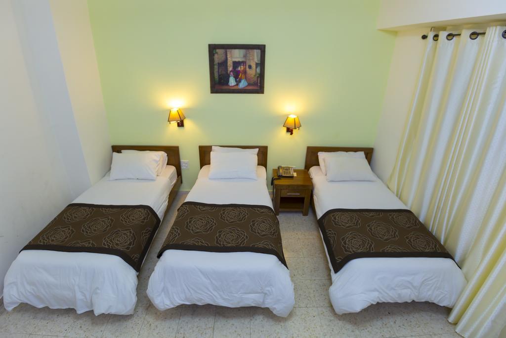 Angel Hotel Belém Quarto foto